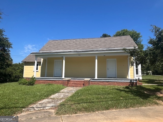 a front view of a house with a yard