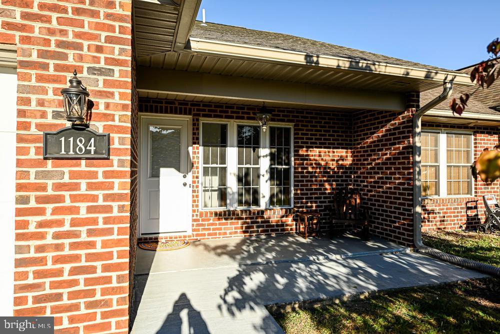 a view of a brick house with a large window