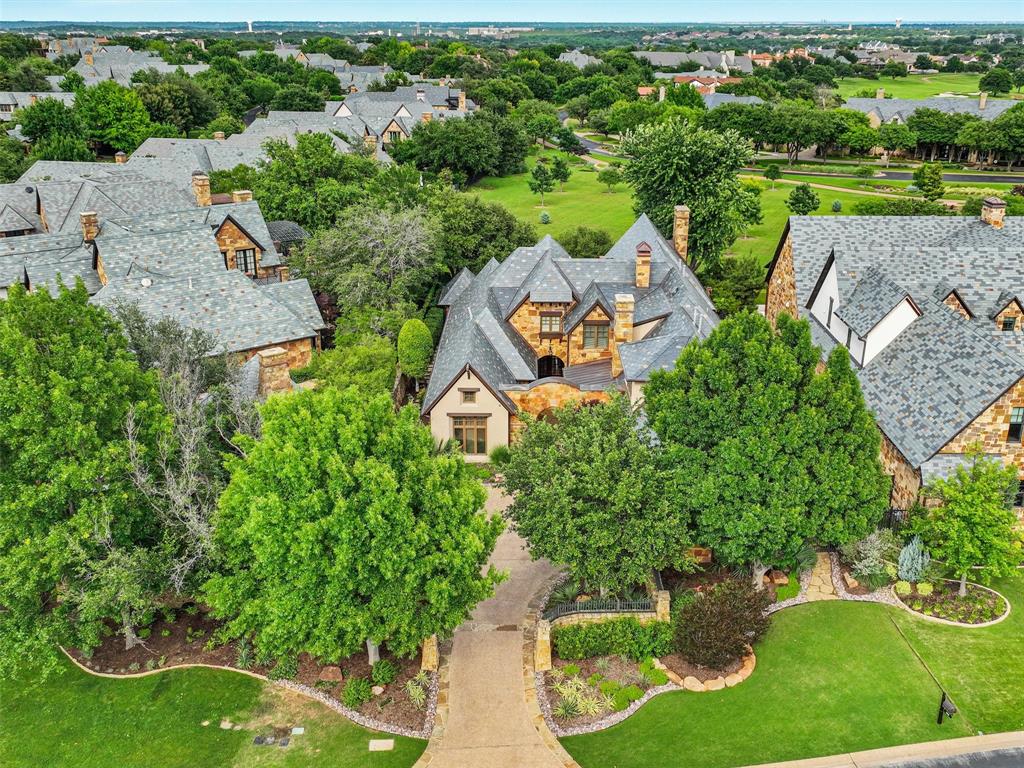 an aerial view of a house with yard swimming pool and outdoor seating