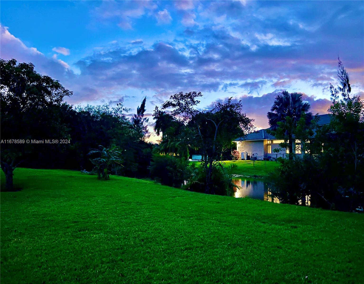 a view of a garden with a building in the background