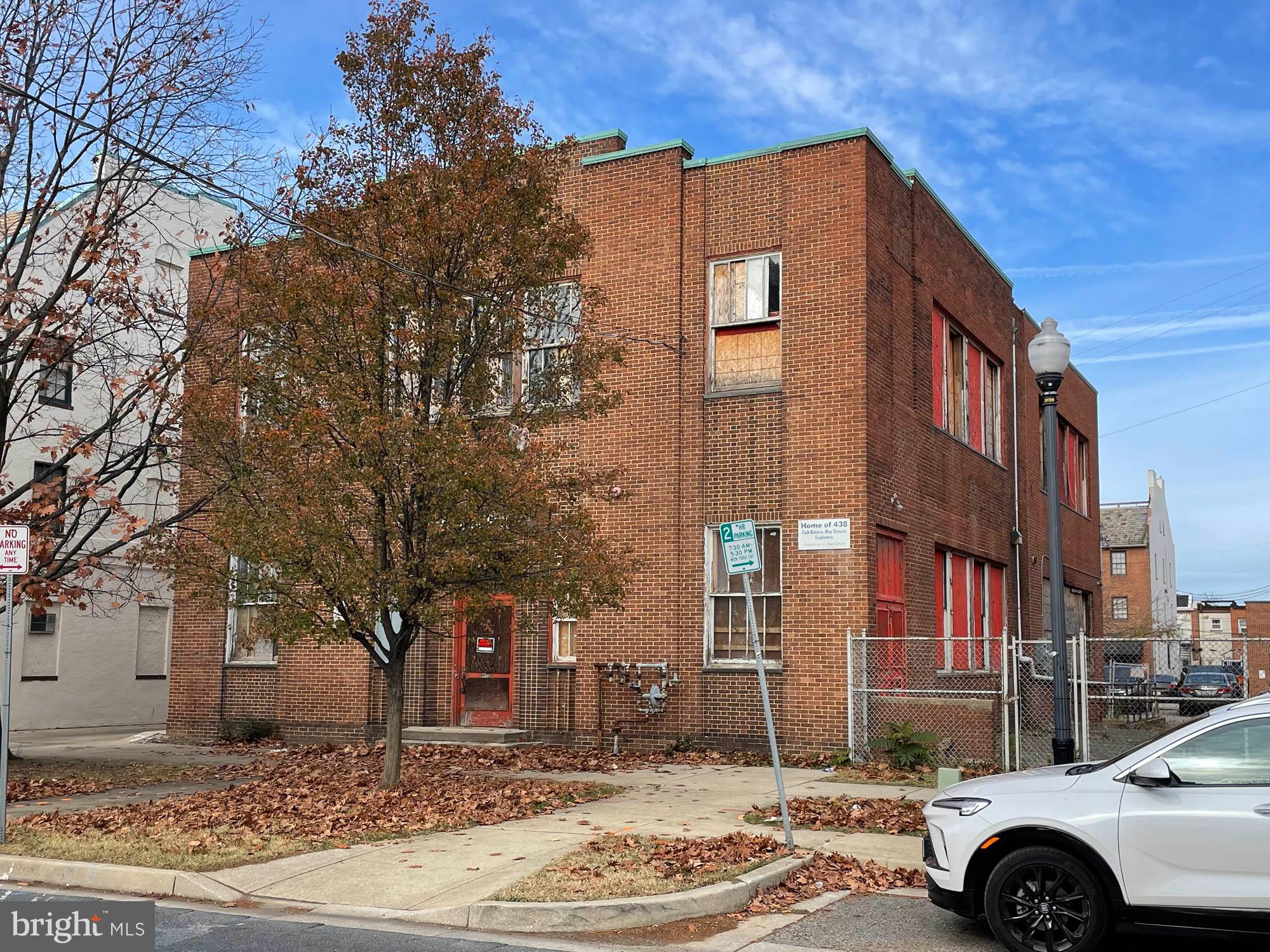 a front view of a building with street view