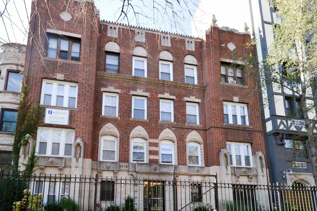 a front view of a multi story residential apartment building