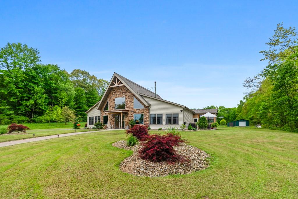 a front view of house with garden