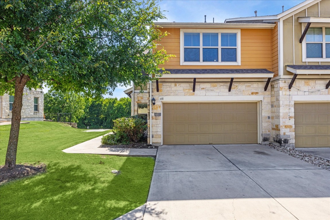 a front view of a house with a yard