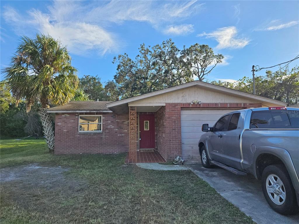 a view of a house with a back yard