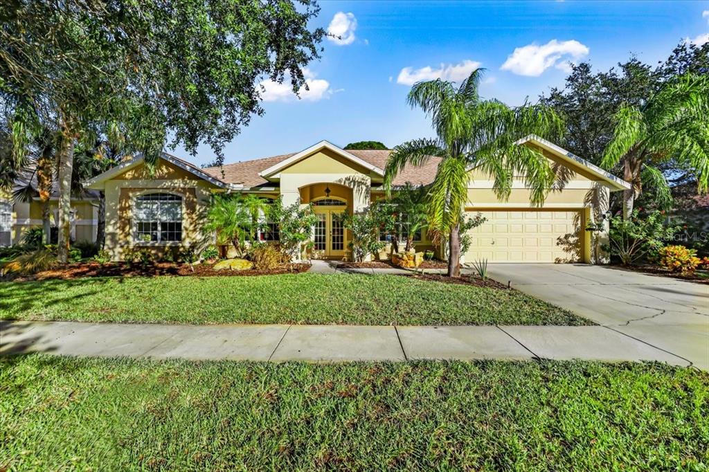 a front view of a house with a yard