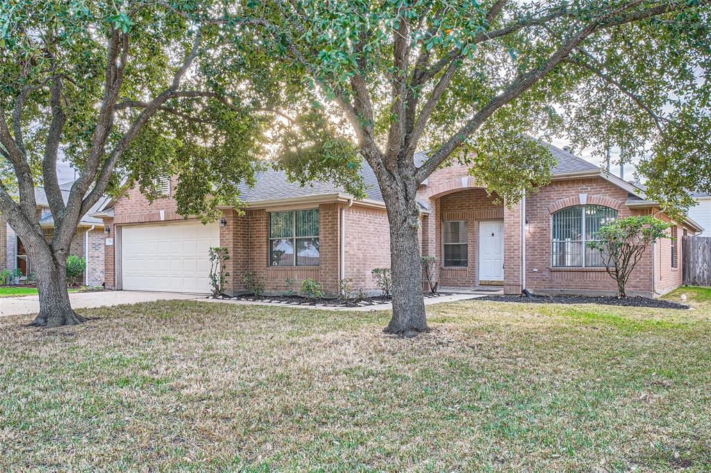 a house that has a tree in front of the house