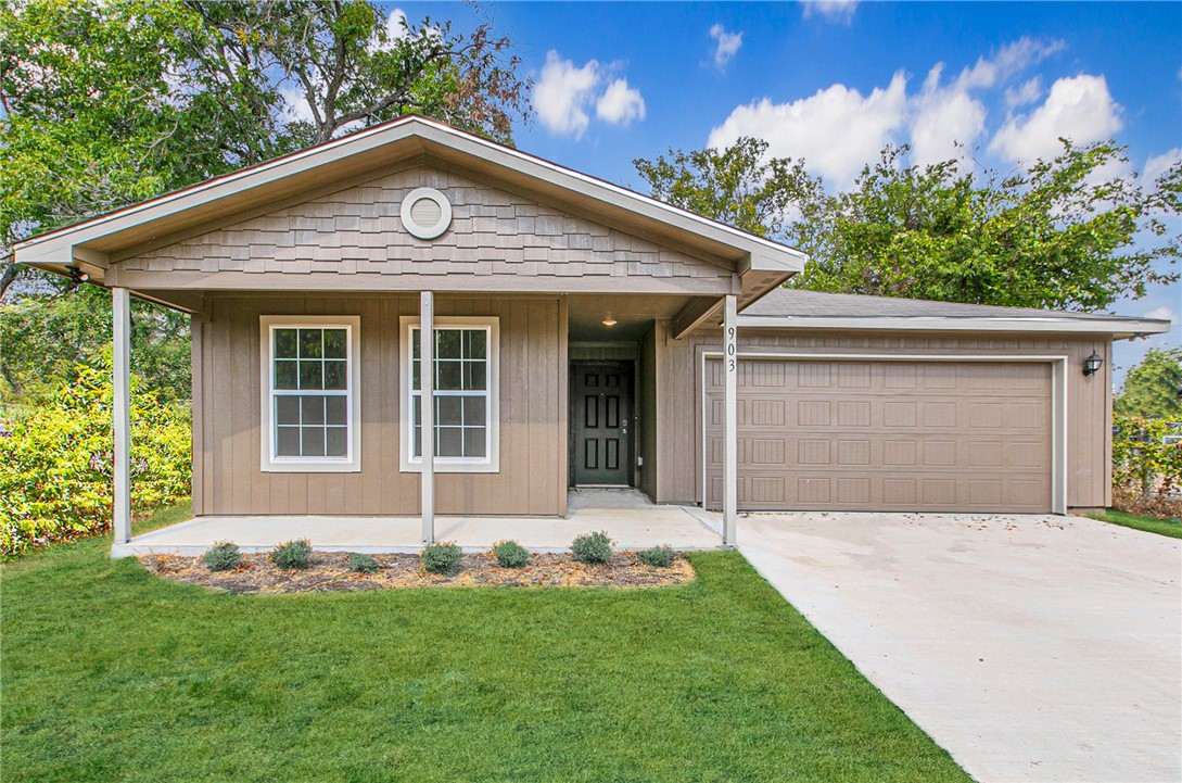 front view of a house with a yard