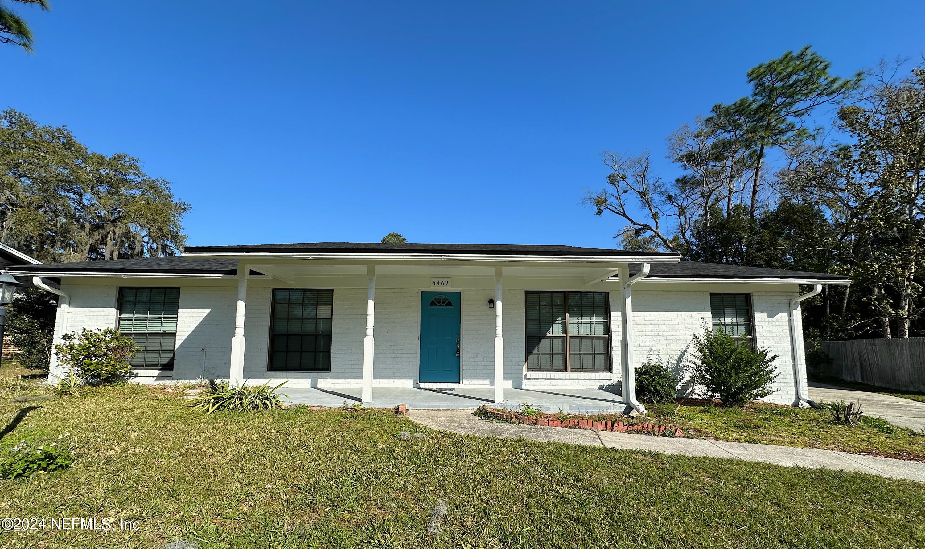 front view of a house with a yard