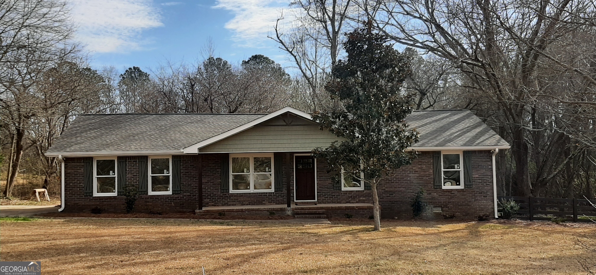 front view of a house with a yard