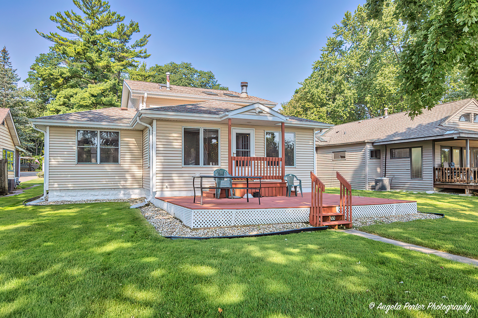 a view of a house with a backyard porch and sitting area