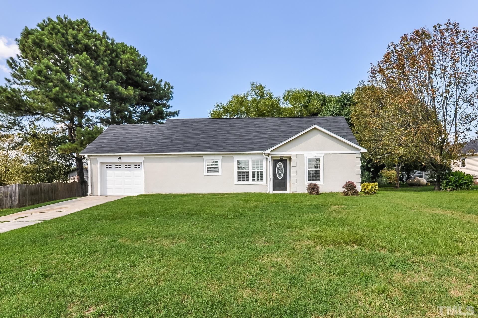 a front view of a house with yard