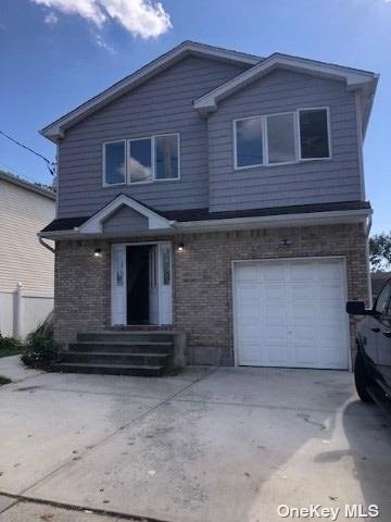 a front view of a house with a garage