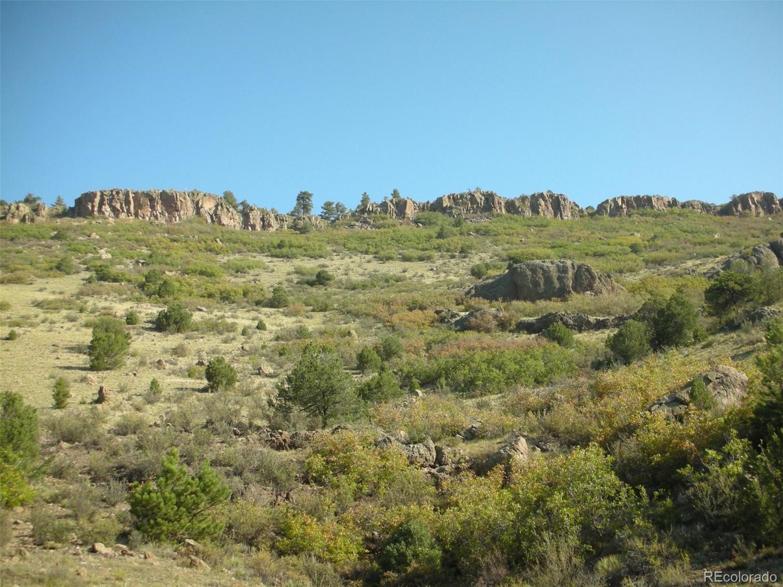 a view of a building with mountains in the background