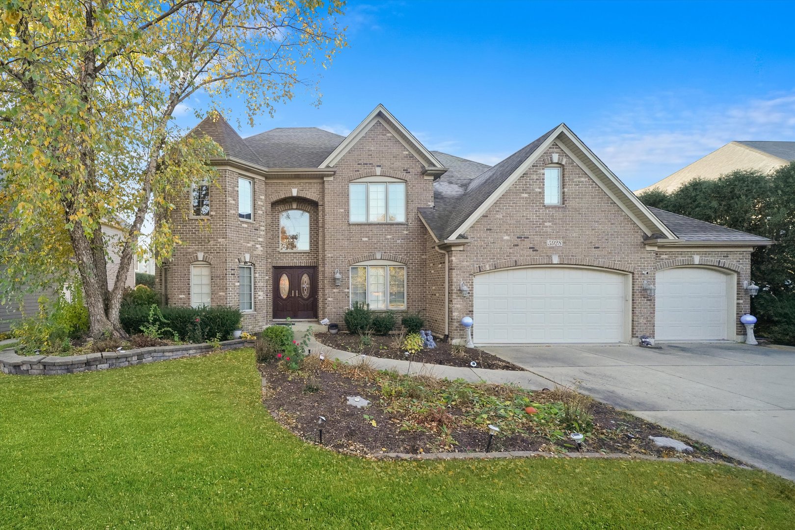 a front view of a house with a yard