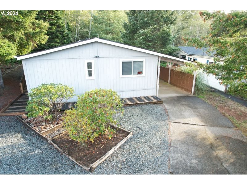 a view of a backyard with plants and a yard