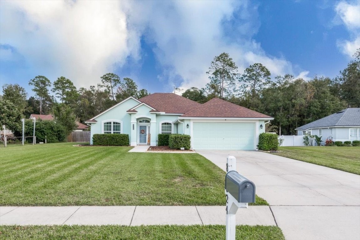 a front view of a house with a yard