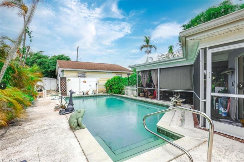 a view of a swimming pool with plants