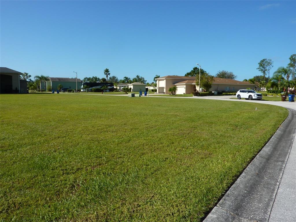 a view of a large building with a yard