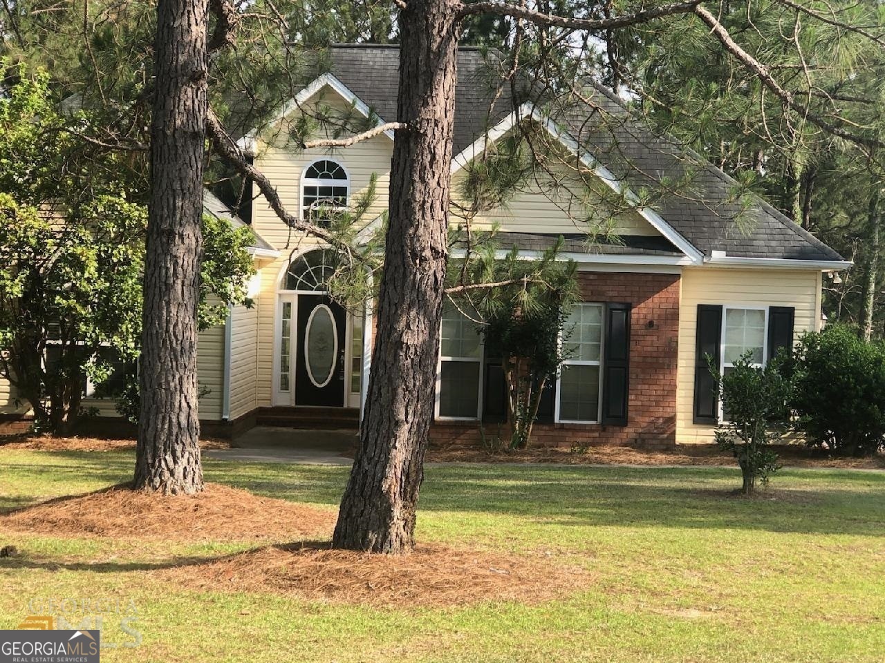 a front view of a house with swimming pool