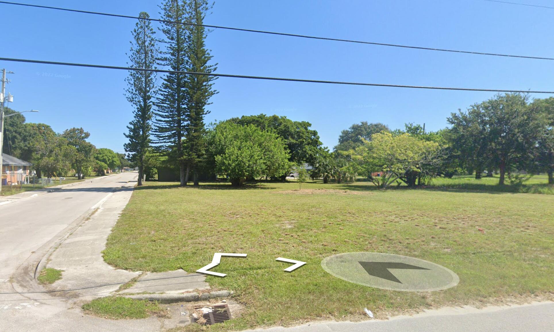 a view of a swimming pool with a yard