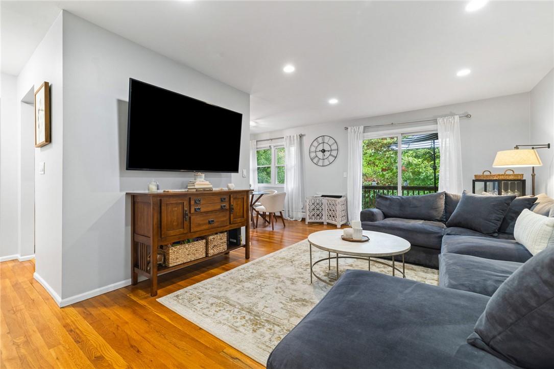 Living room with wood-type flooring