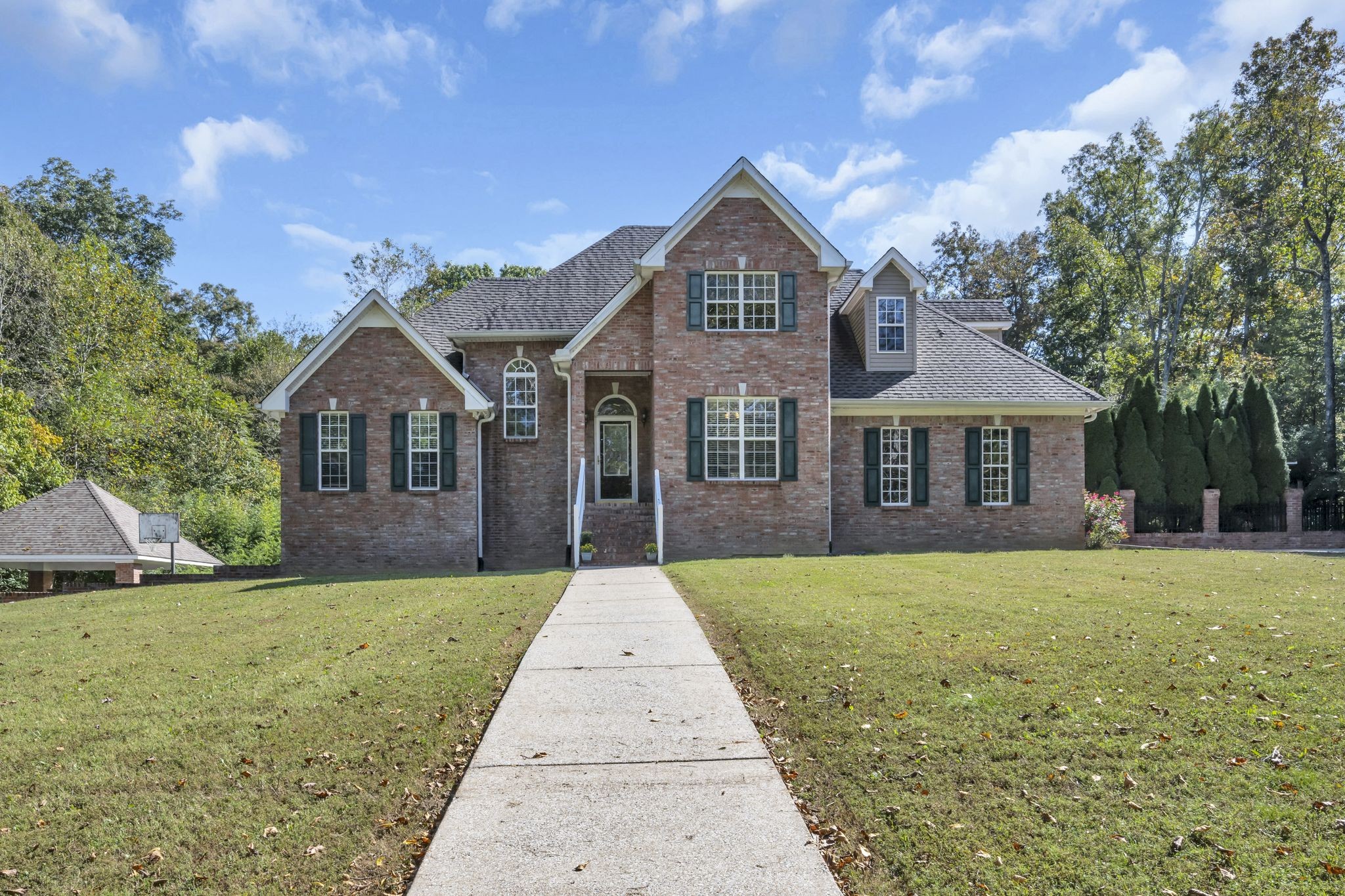 a front view of a house with yard