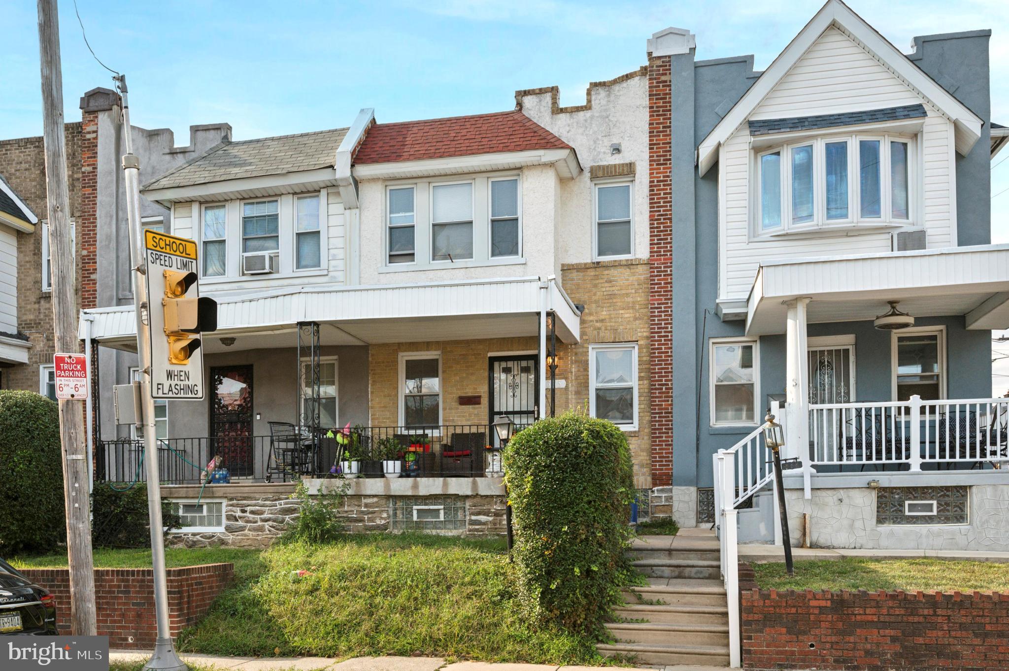 a front view of a residential apartment building with a yard