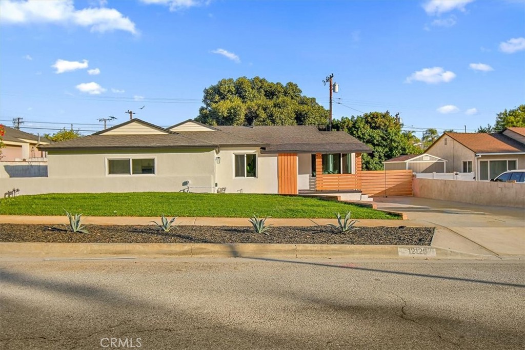 front view of a house with a yard