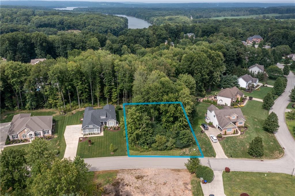 an aerial view of a house with yard