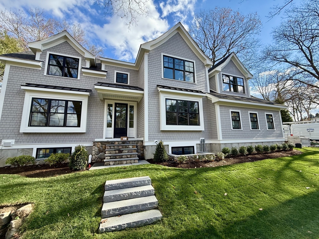 a front view of a house with a yard