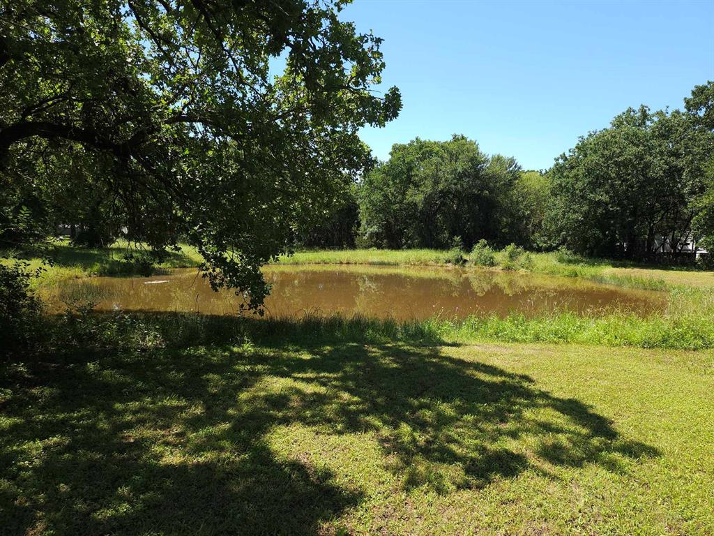 a view of a lake with a yard