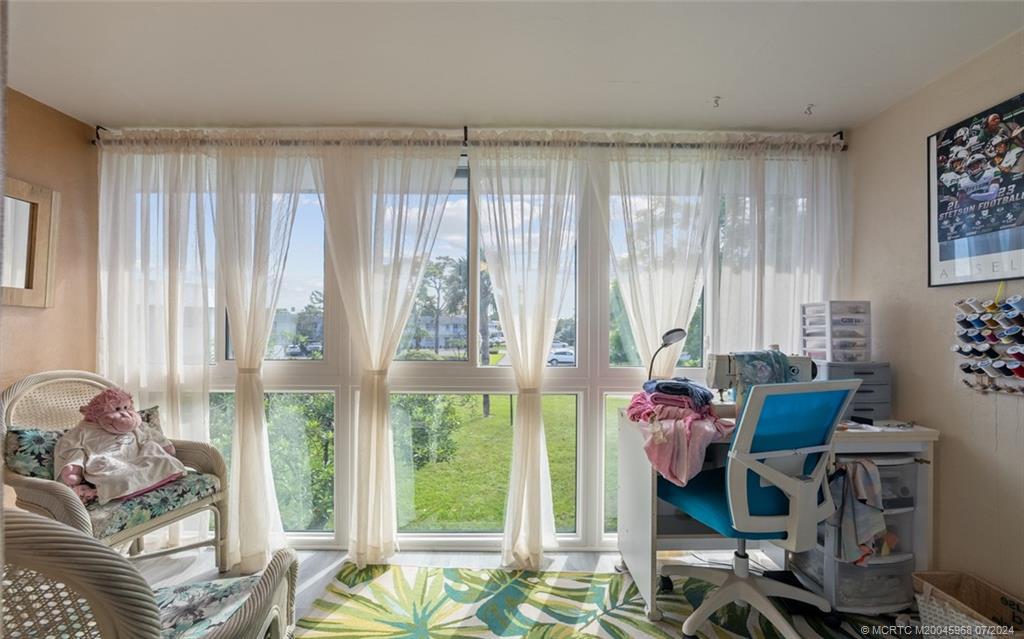 a living room with furniture and a window