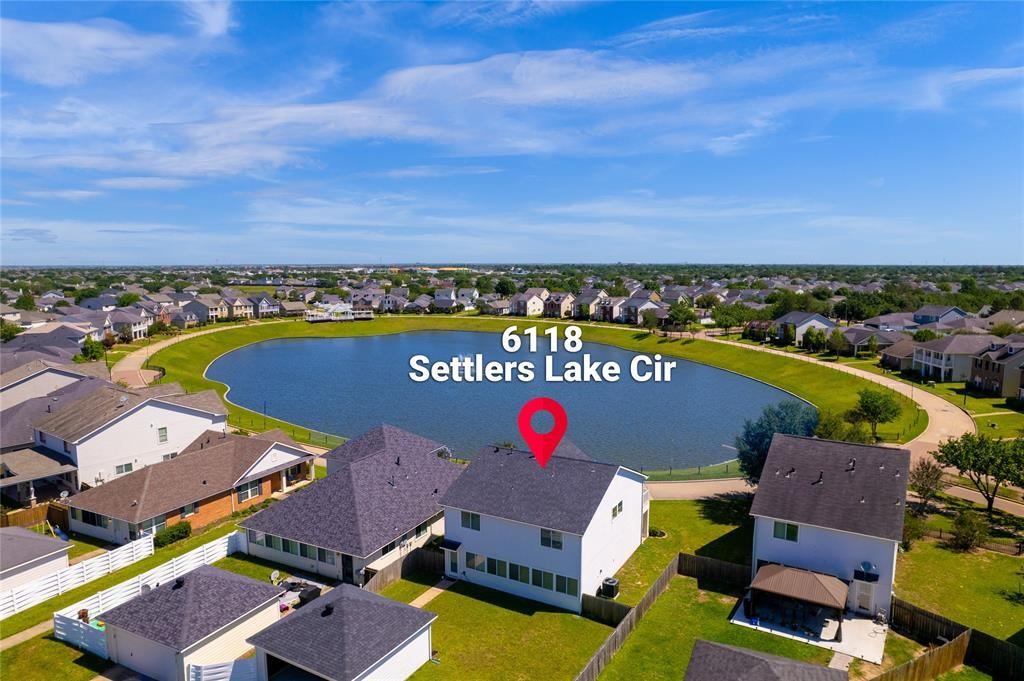 an aerial view of a house with a swimming pool