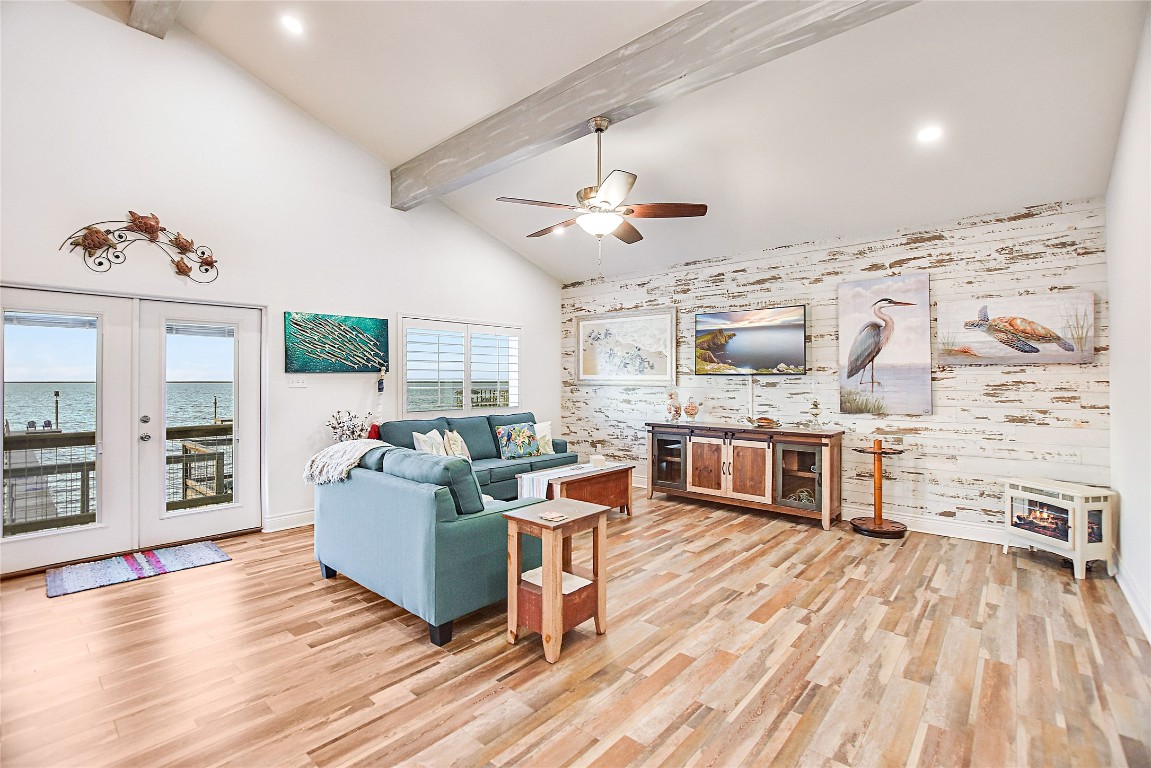 Wow! Welcome to your new BEACH HOUSE!  Gorgeous high beamed ceilings!  Views, views, views!  And check out this gorgeous "shiplap" wall!  Summer is coming!  This is a rare find in Rockport!