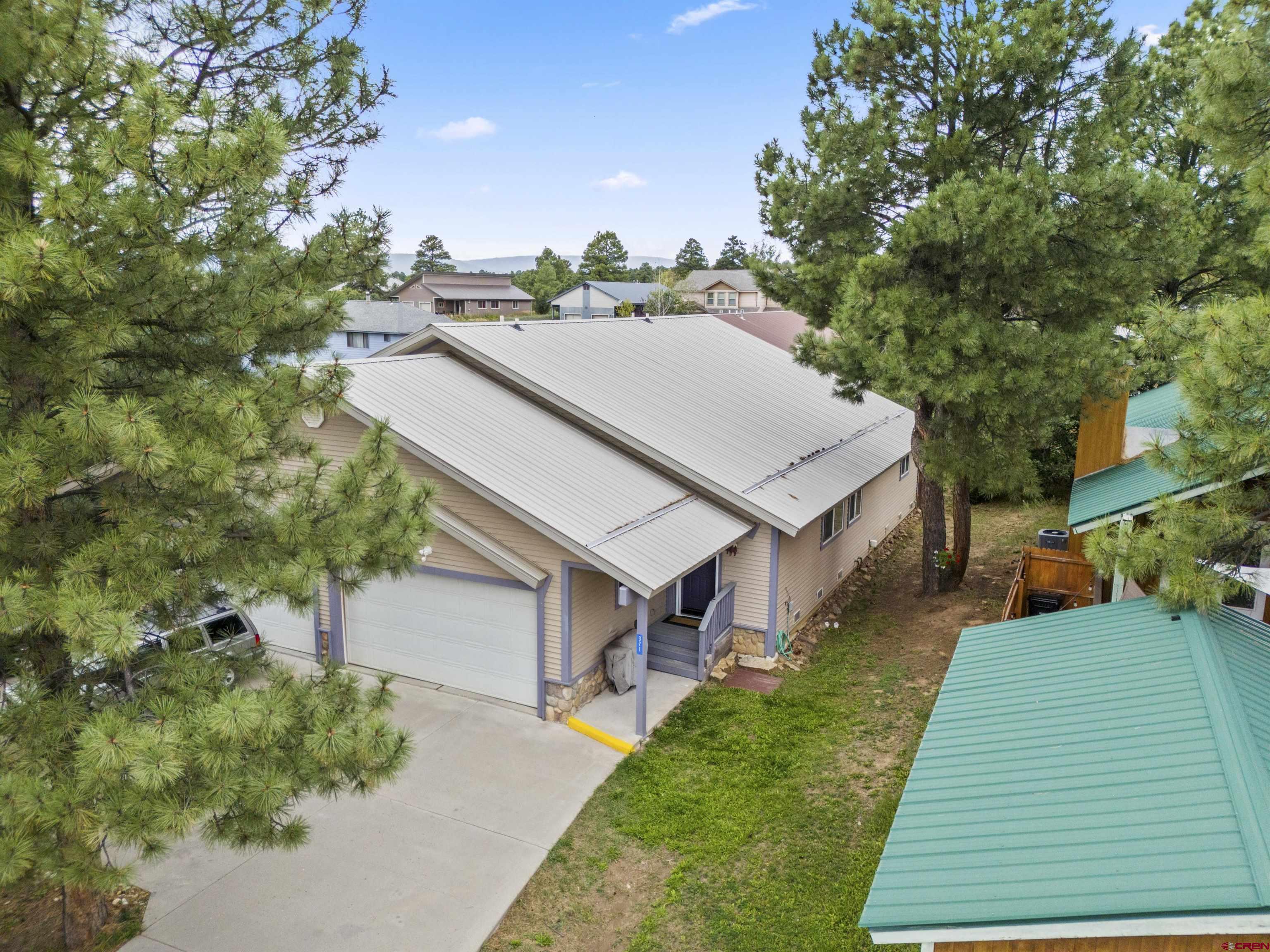 a aerial view of a house with a yard