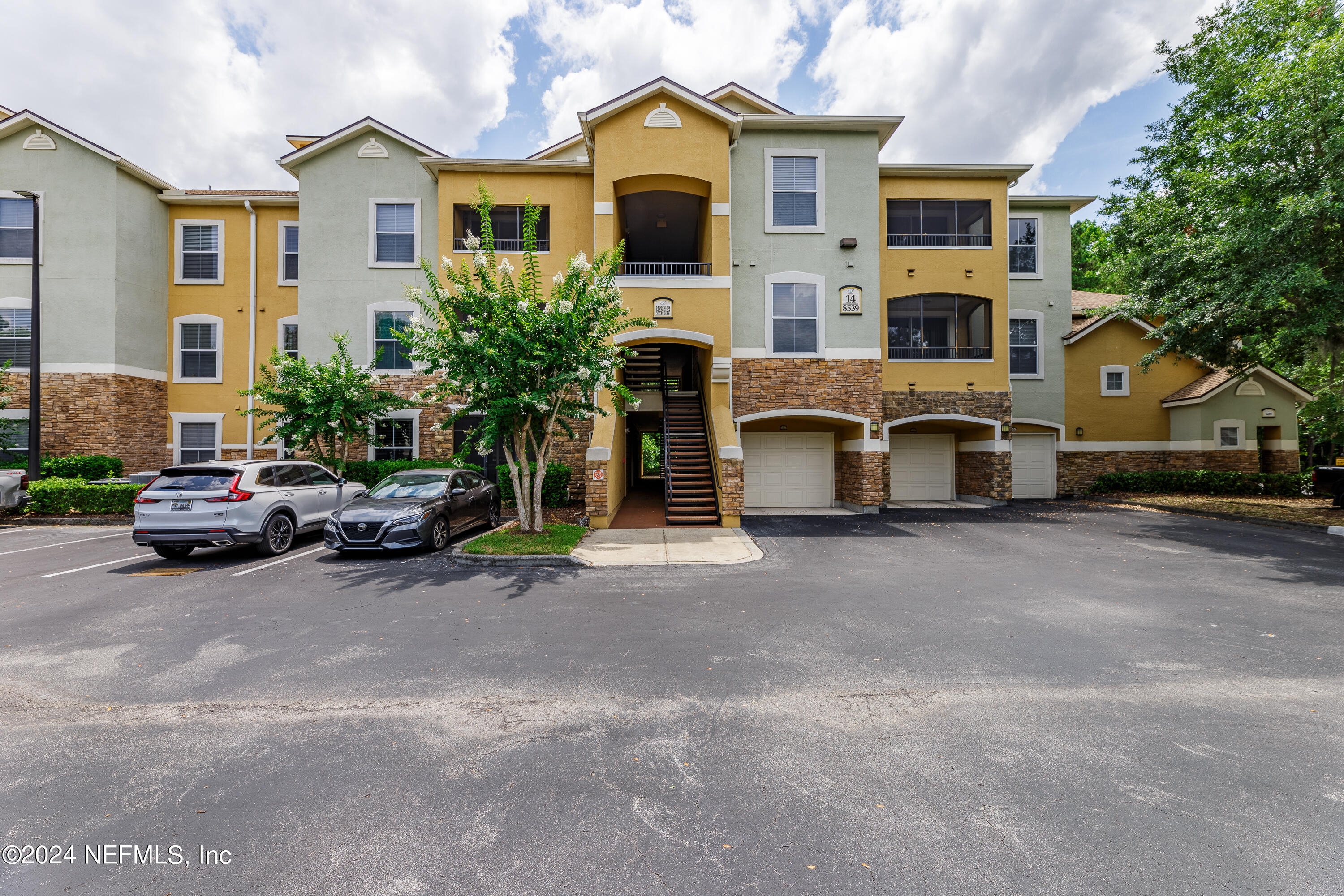 a view of a car park in front of house