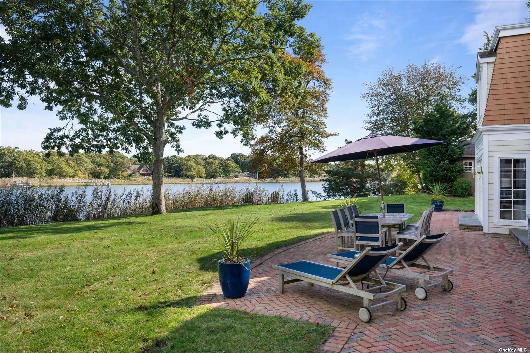 a view of a backyard with chair and table