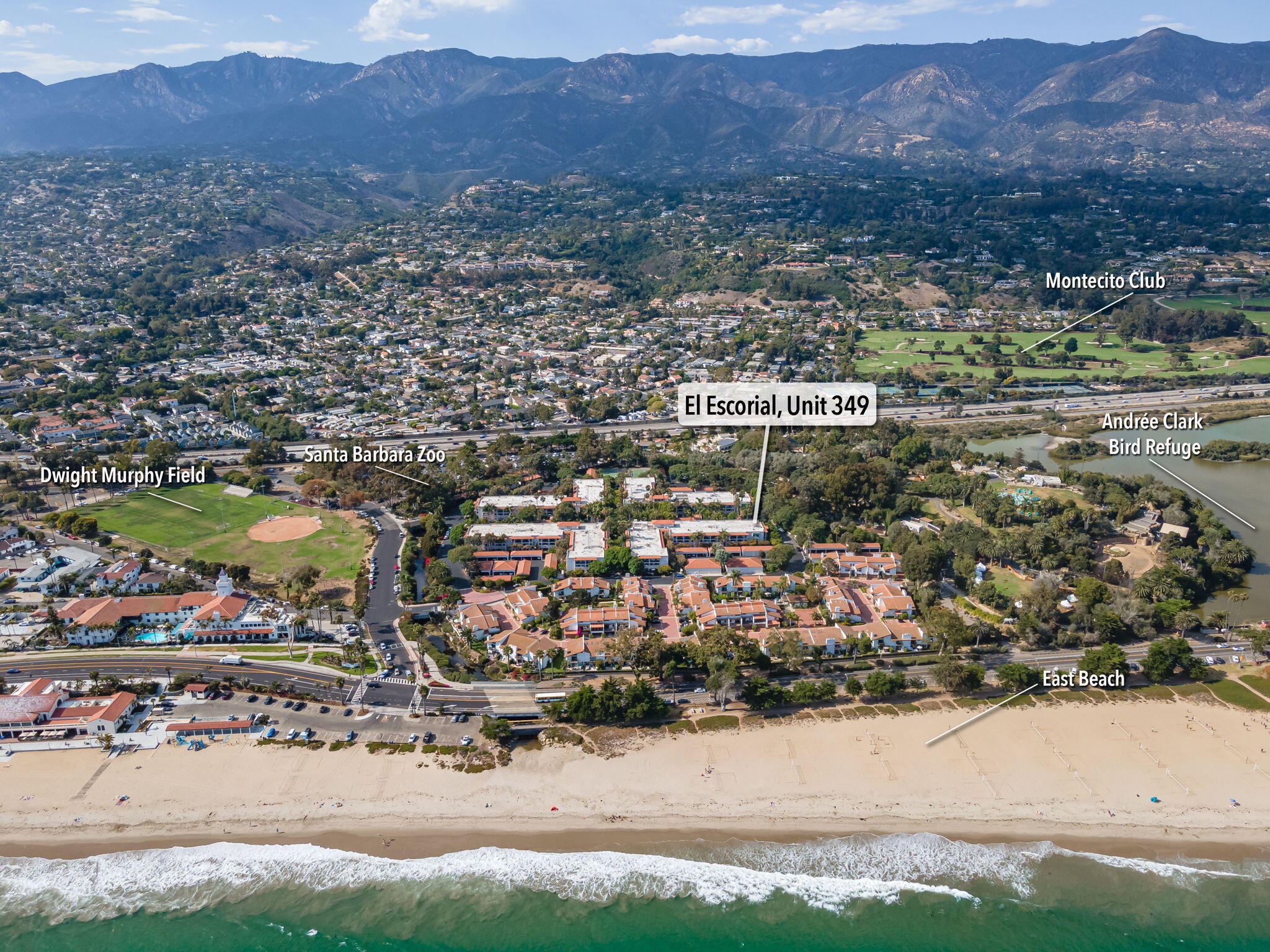 an aerial view of residential house and sandy dunes