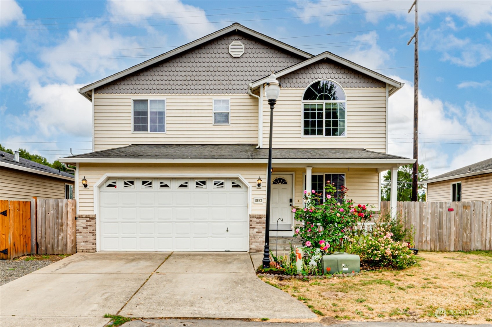 a front view of a house with a yard