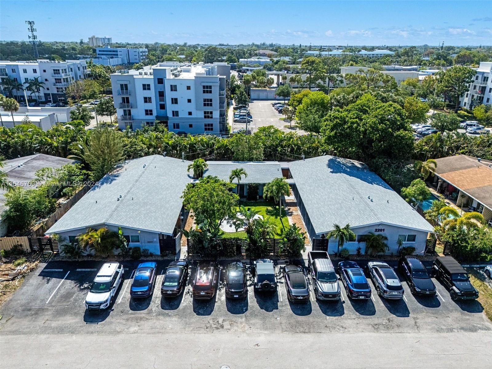 an aerial view of a house with garden space and street view