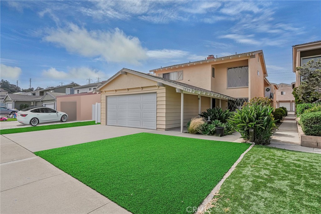 New bright beautiful artificial turf, New paint, New Vinyl fencing, New garage doors & motors, roof upgrades...