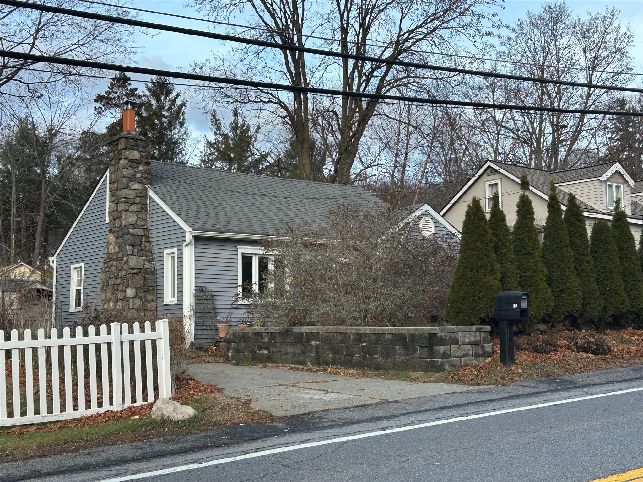 a view of a house with a street