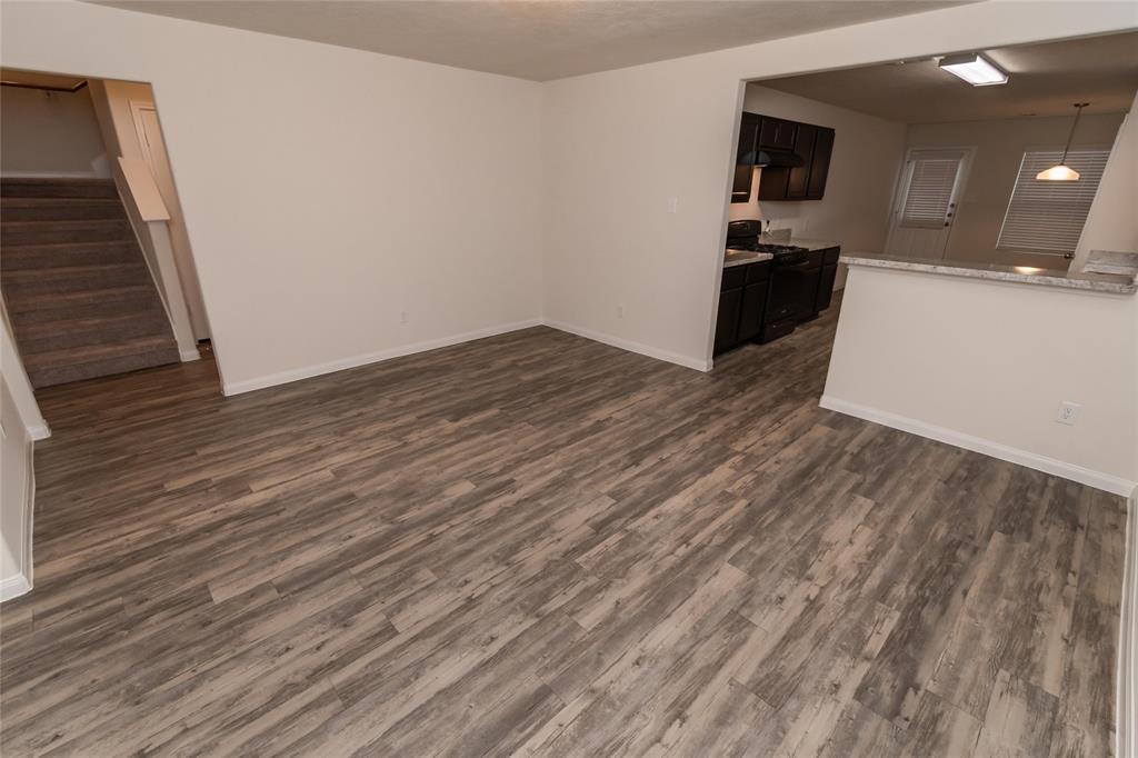 a view of a kitchen from the hallway