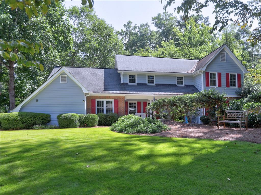 a view of a house with a yard