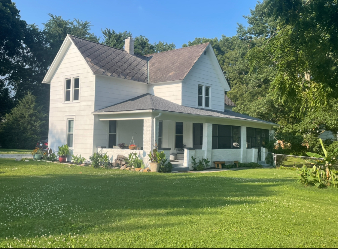 a front view of a house with garden