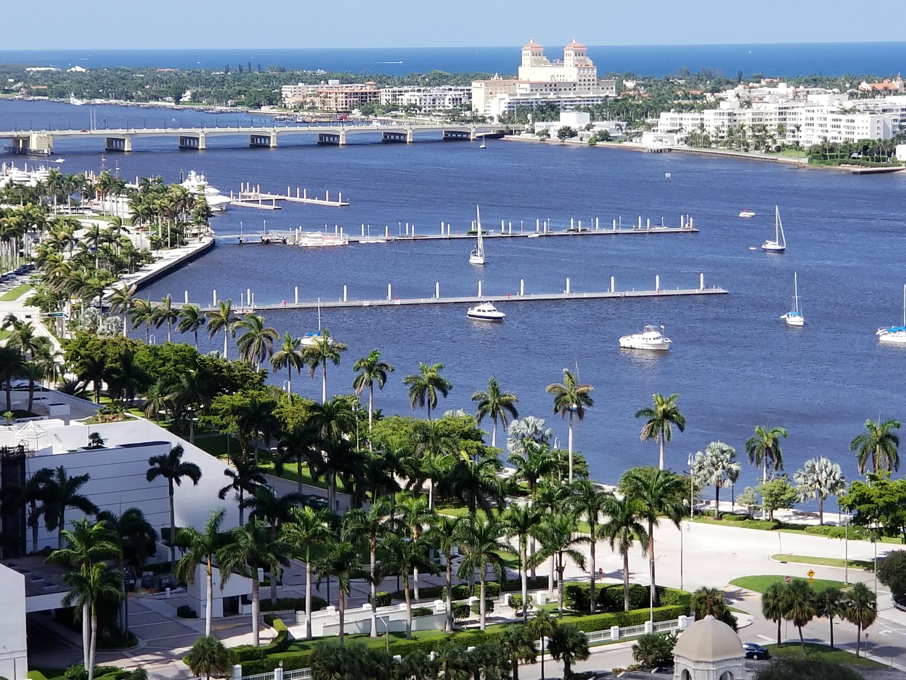 an aerial view of a building with outdoor space and lake view