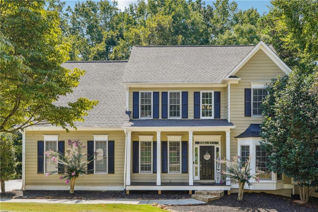 front view of a house with a yard