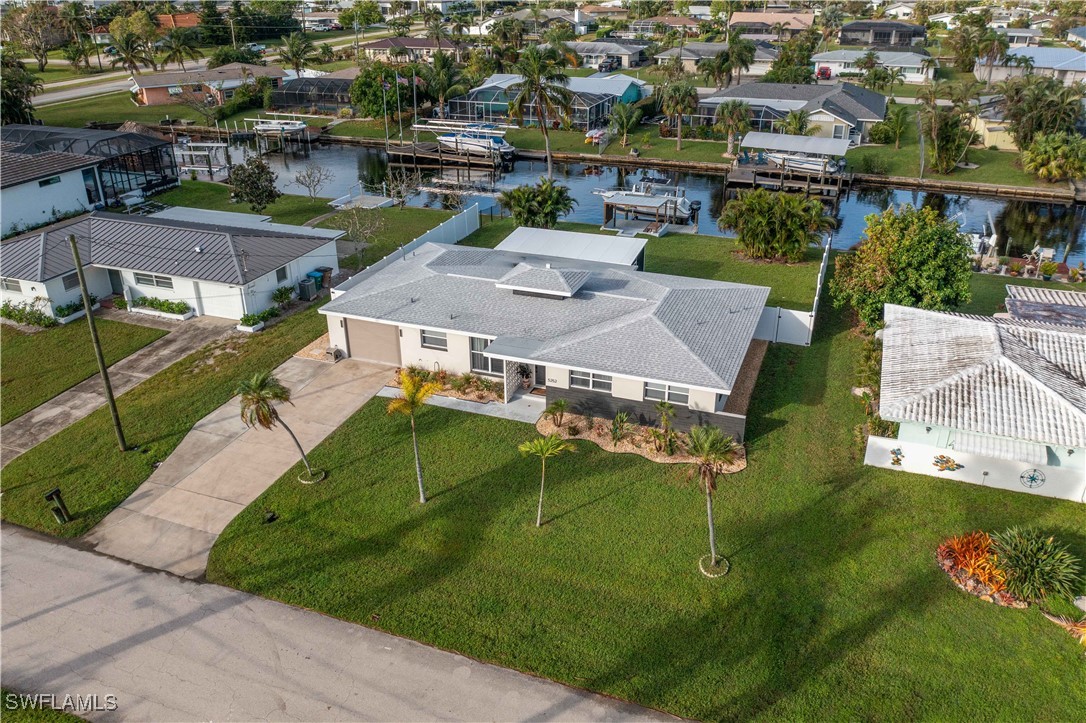 an aerial view of a house with a garden