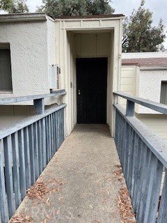 a view of balcony with wooden floor